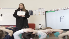 Image from Phonics Plus video with teacher at a whiteboard